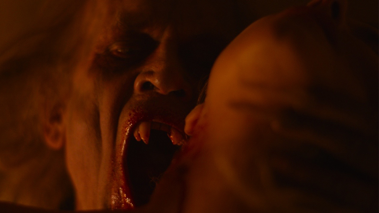Anders Hove biting a victim as Radu in Subspecies V: Blood Rise