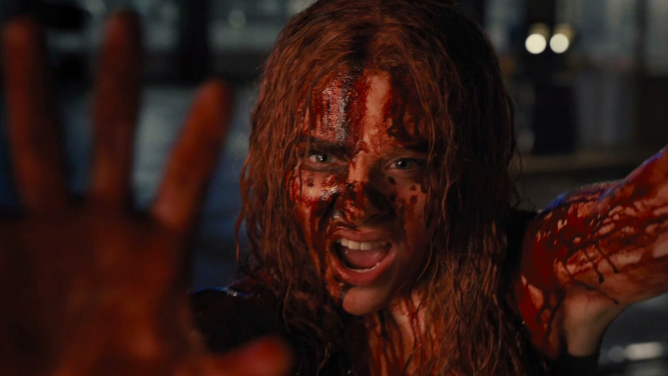 Chloë Grace Moretz covered in blood as Carrie White in Carrie (2013)